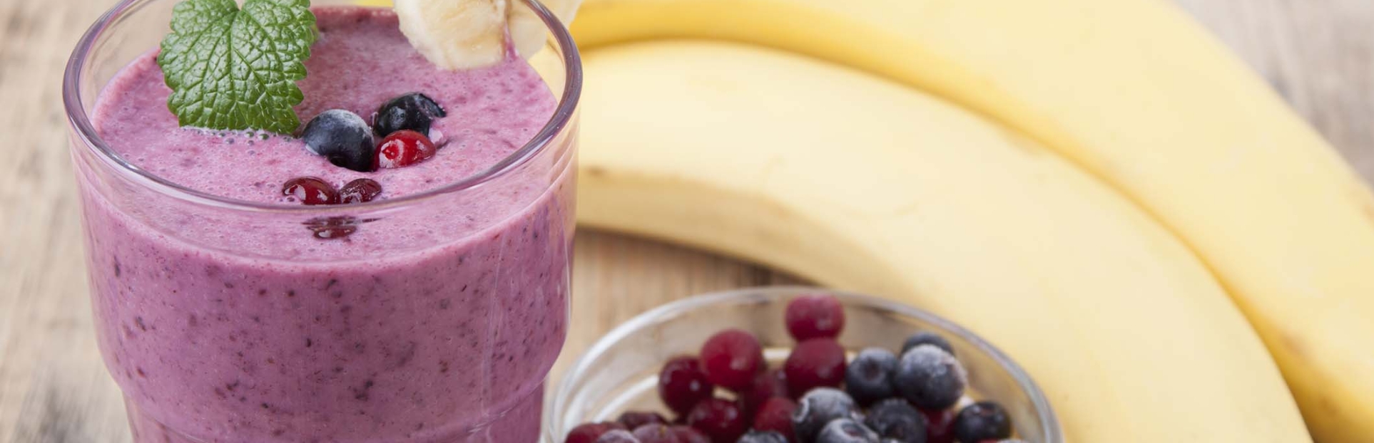 an image of a smoothie with bananas and berries