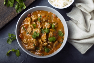 an image of chicken curry in a bowl